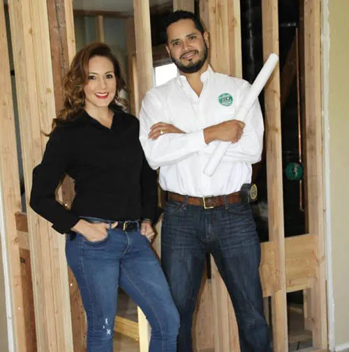 Mario and Marisela reviewing plans on site